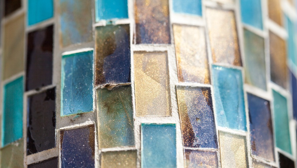 A close up of blue, gold and grey mosaic tiles