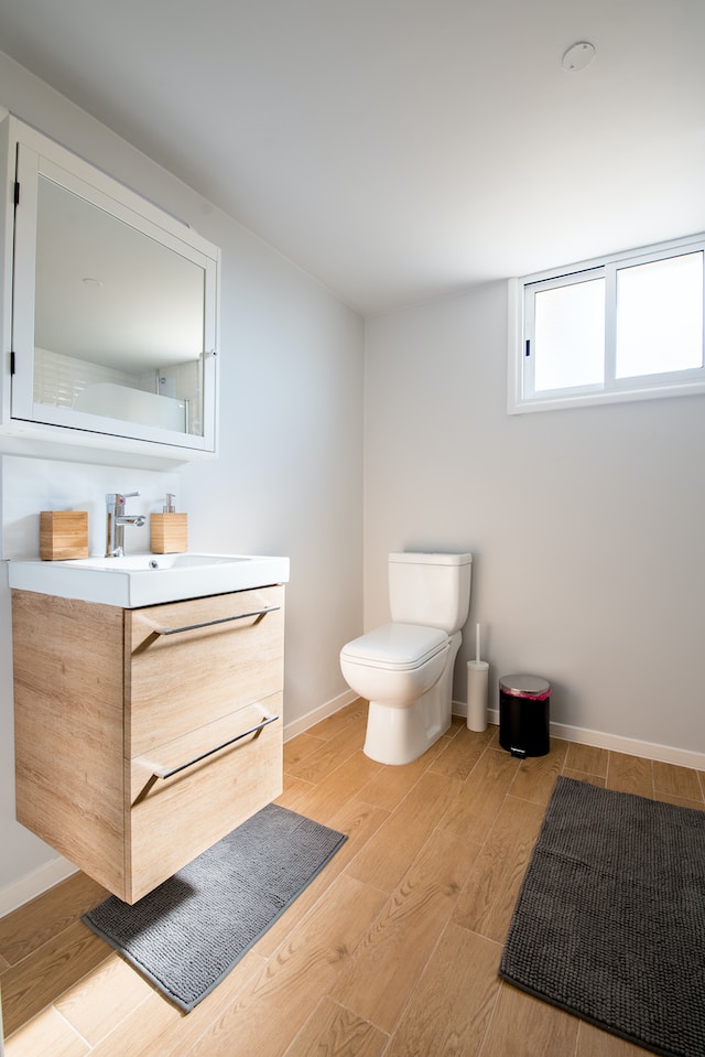 Lifestyle image of a bathroom with wood-effect floor tiles