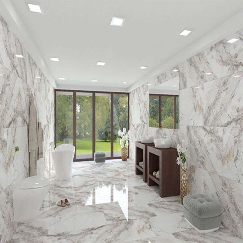 Lifestyle image of a luxury bathroom with veined marble tiles