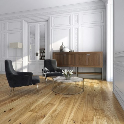 A room with a wood floor, table, chairs and cabinet.