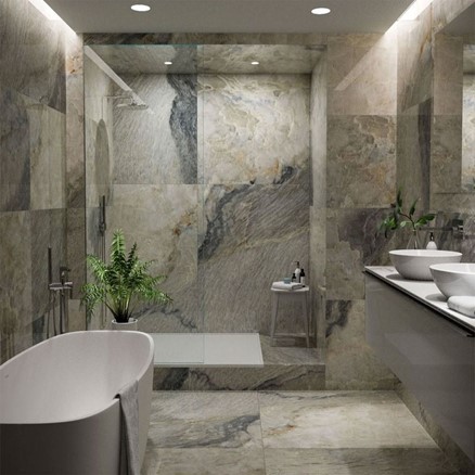 A bathroom with a bathtub, separate shower and two sinks.