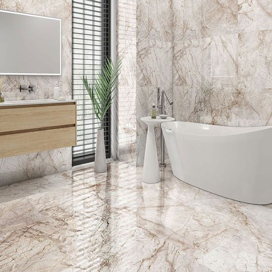 A neutral toned modern bathroom with marble effect large tiles on the walls and floor