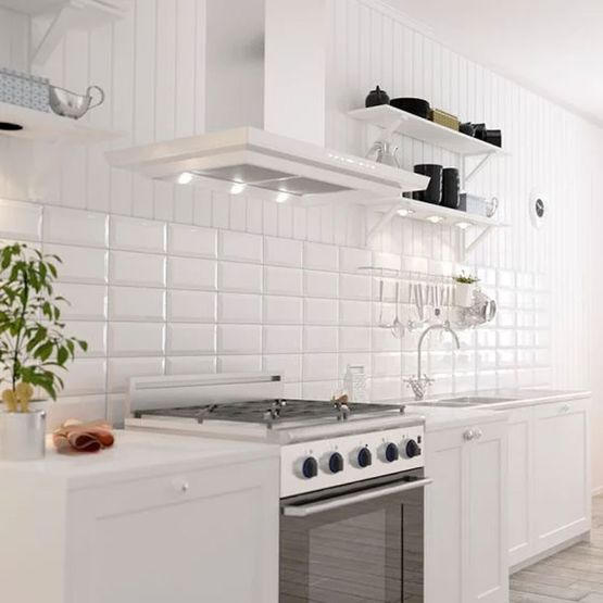 A white kitchen with white gloss metro tiles