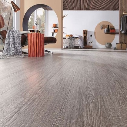A large room with embossed textured laminate flooring.