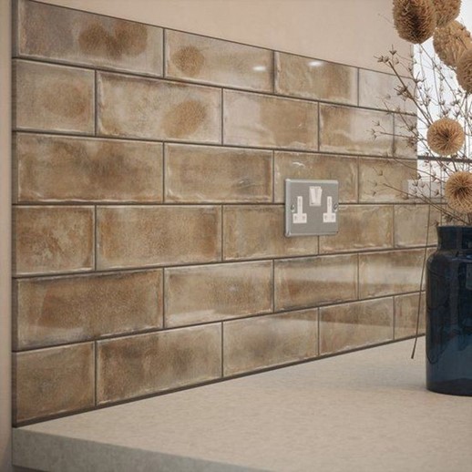 Gloss finish ceramic wall tiles in neutral beige shades.