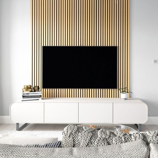 A living room with natural oak wall panels behind a mounted TV.