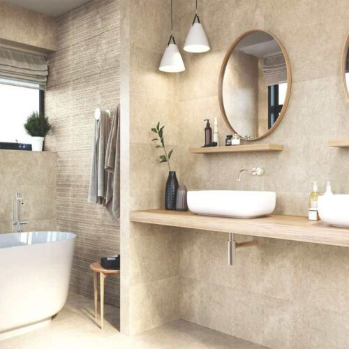 A beige bathroom with a rectified tiles, a bathtub, a mirror and a sink.